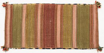 A double-interlocked tapestry carrige cushion from Scania, ca 99 x 49 cm, first half of the 19th century.