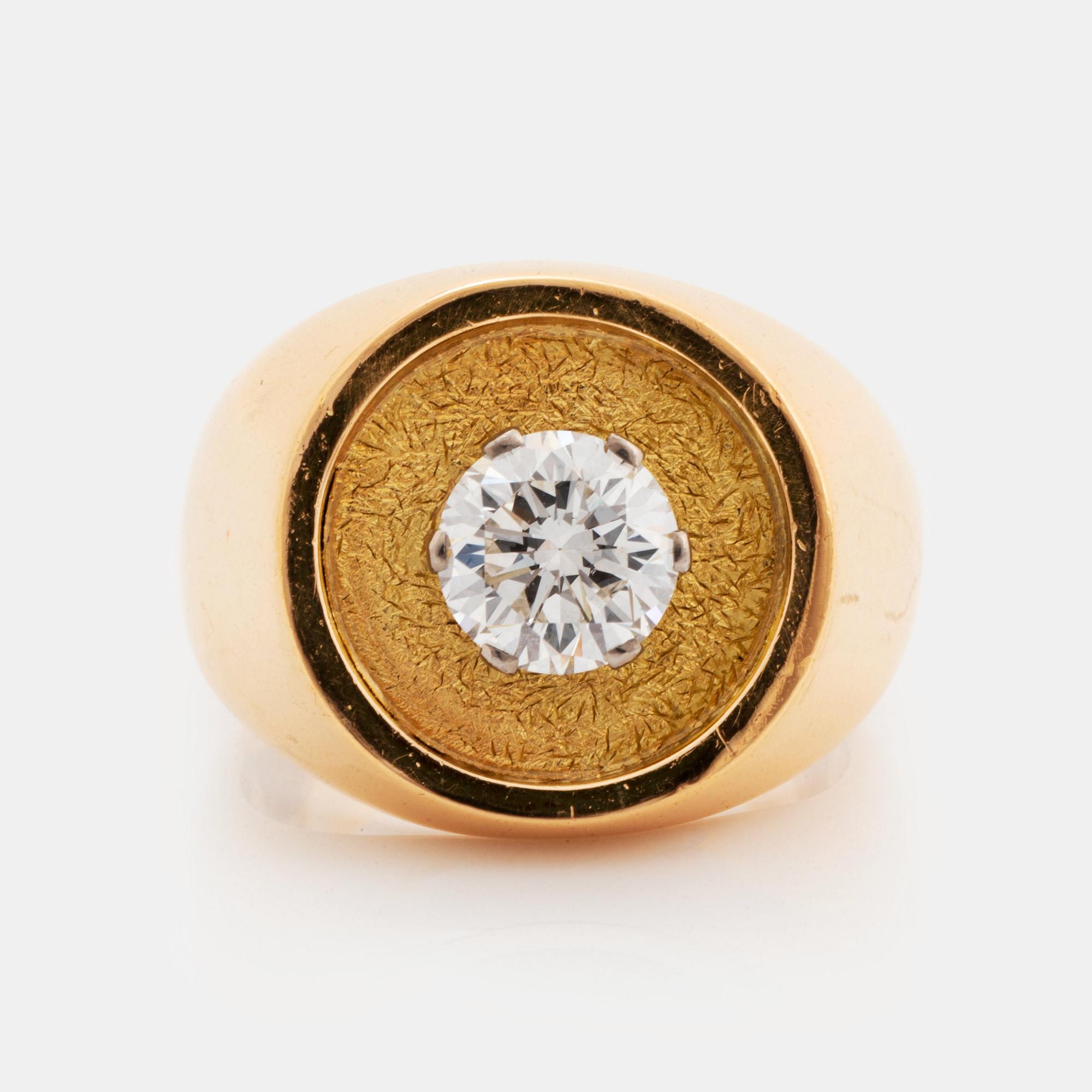 A WA Bolin ring in 18K gold set with a round brilliant-cut diamond.