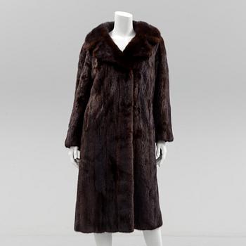 a mink coat by Johnssons Päls, Malmö, size app 40.