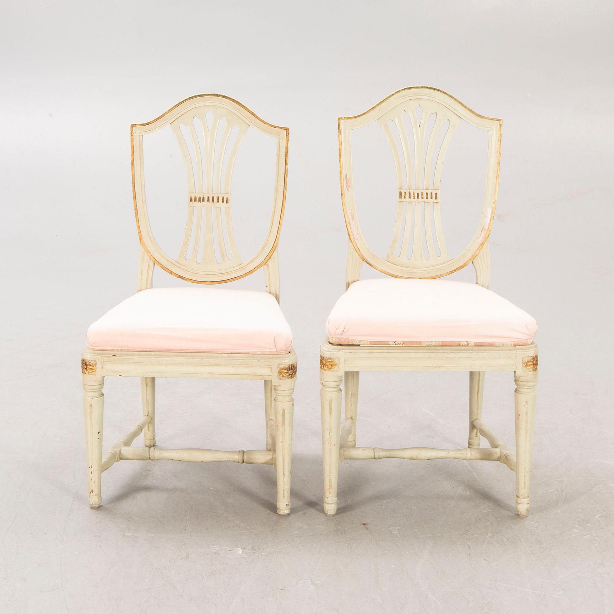 A öpair of painted Gustavian chairs.