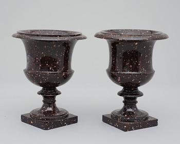 A pair of Swedish Empire 19th century porphyry urns.