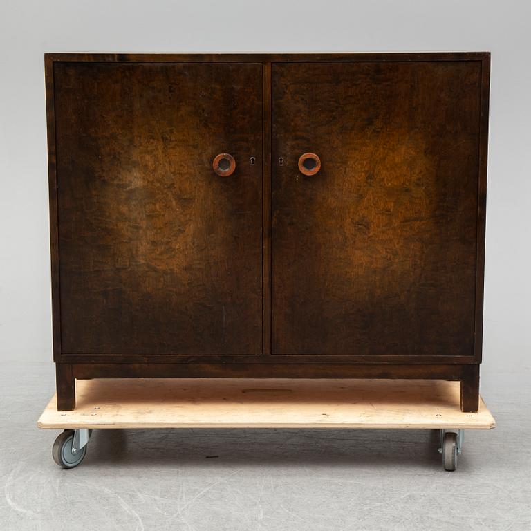 A stained birch veneered cabinet, 1930's.