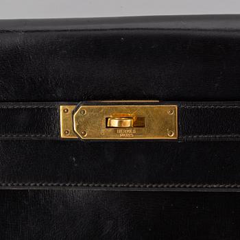 Hermès,a black leather 'Kelly 32' handbag, 1975.
