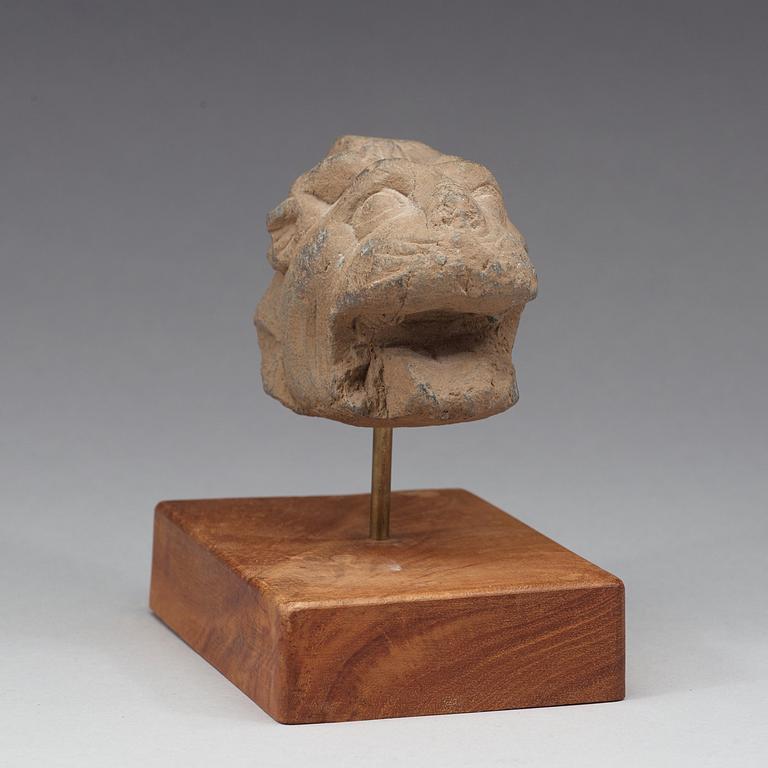 A schist sculpture fragment of a lion, Gandhara, 2nd-3rd Century.