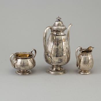 A three part silver coffee service.