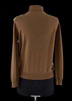 A polo neck sweater by Hermès.