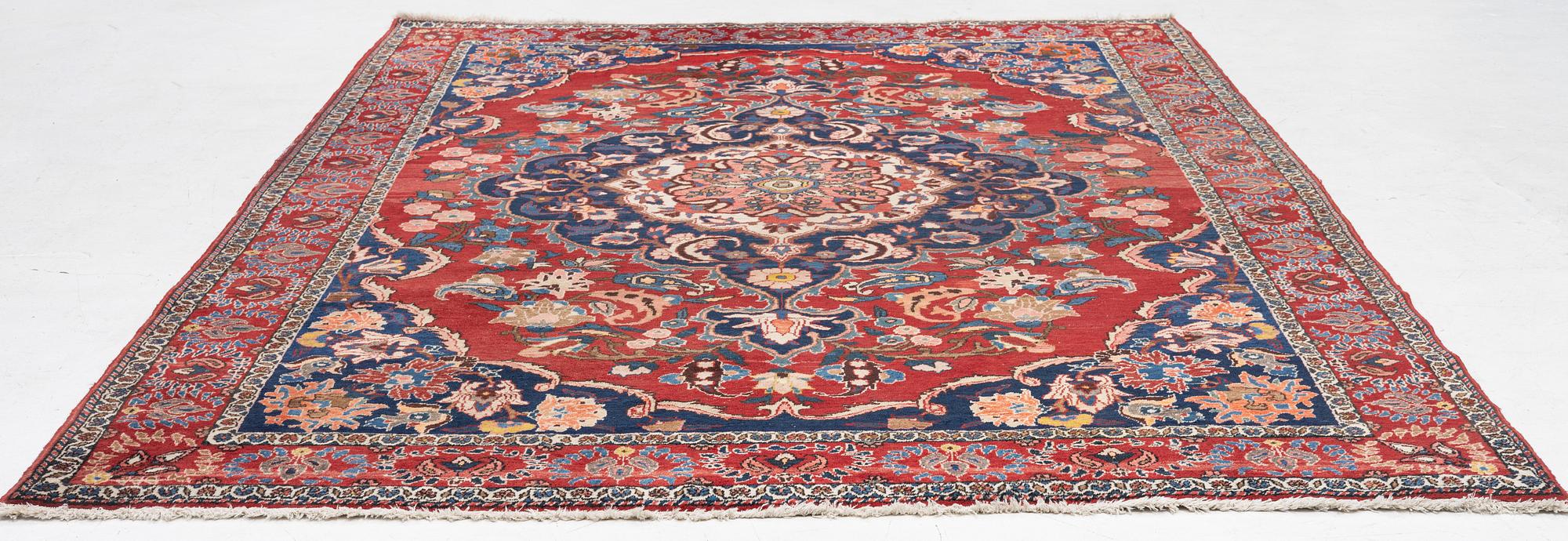 An Persian carpet, ca. 310 x 215 cm.