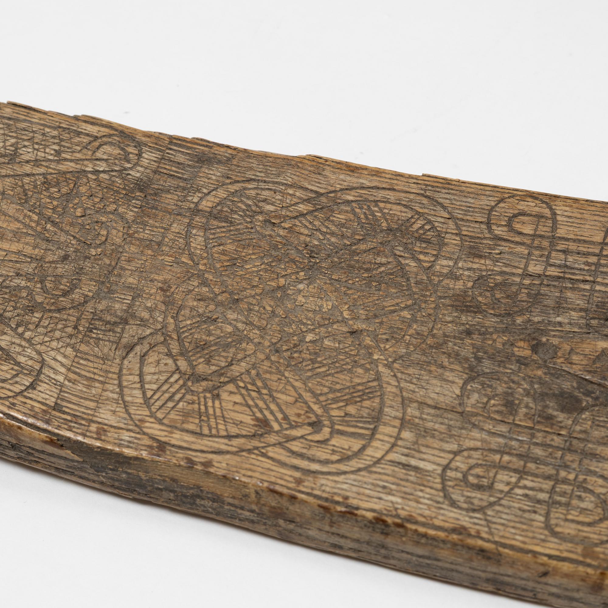 A Swedish folk art mangle board, dated 1666.