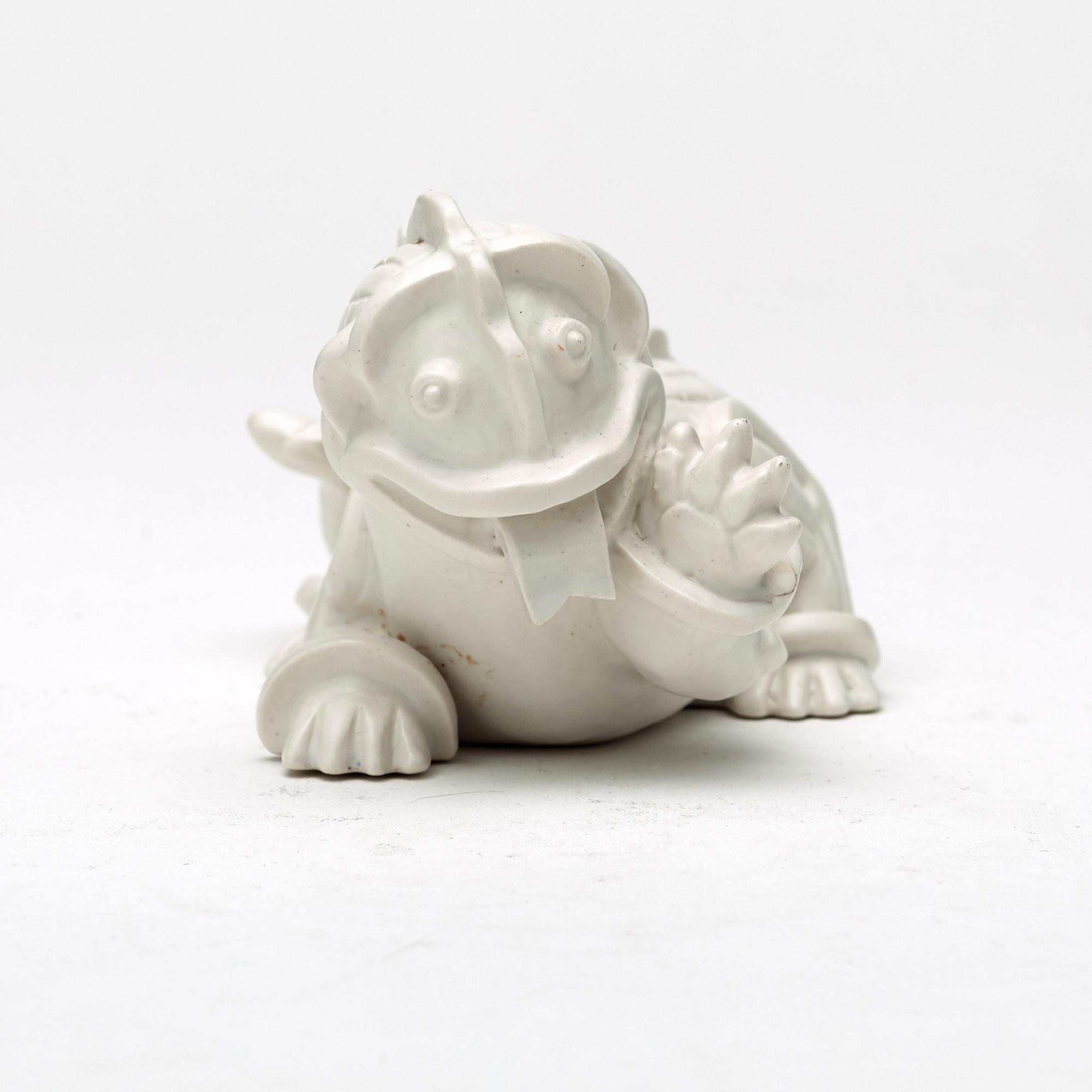 Wilhelm Kåge, a set of stoneware figures of a 'dragon puppy' and two 'dragon puppies' with candle holders, Gustavsberg, ca 1940.