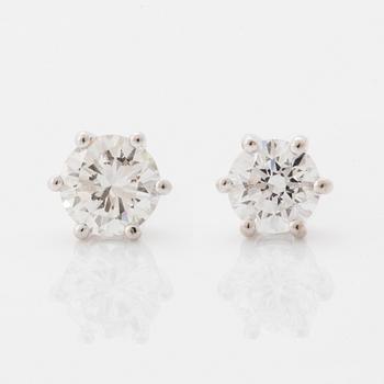 Brilliant-cut diamond stud earrings.