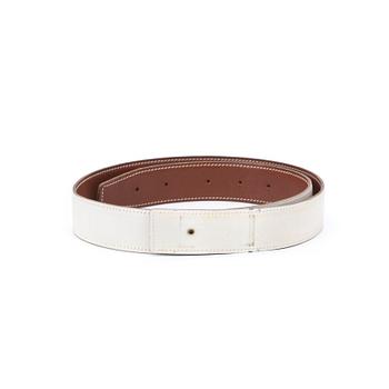 HERMÈS, four reversible belts, black and brown with gold coloured H belt buckle.