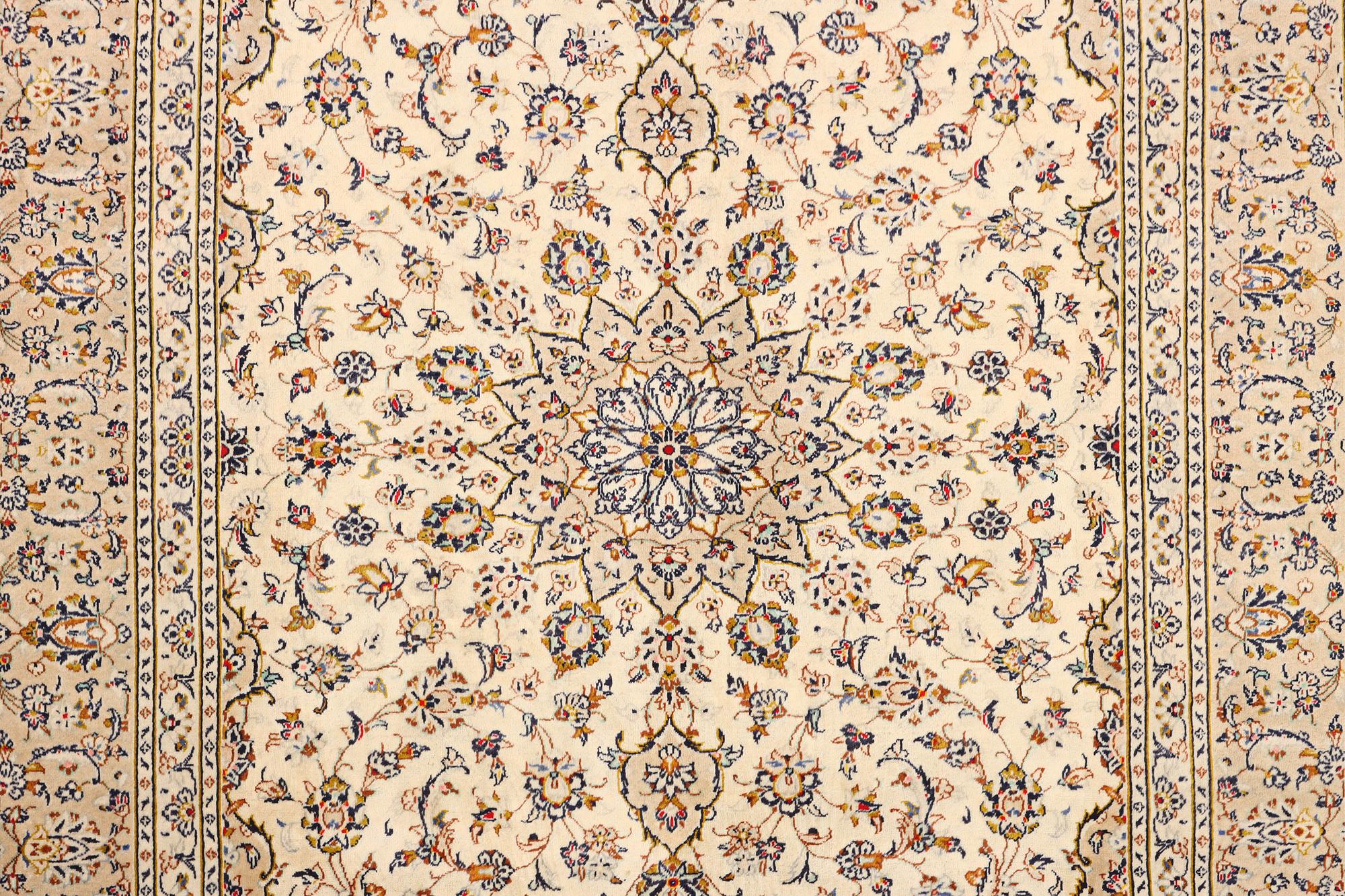 A Kashan carpet, c. 355 x 242 cm.