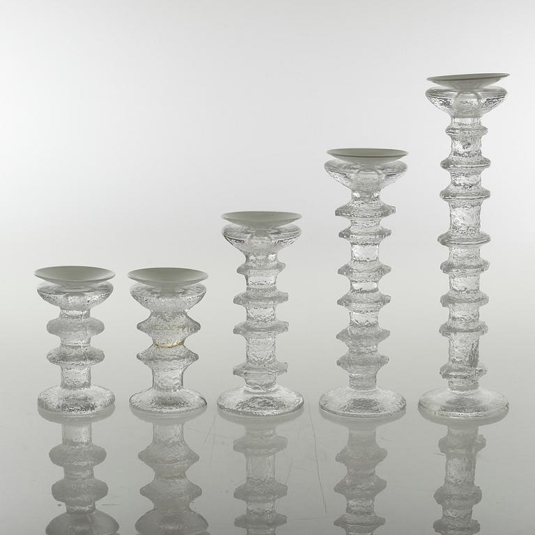 Five glass candlesticks by Timo Sarpaneva for Iittala, model "Festivo", second half of the 20th century.