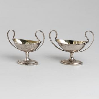 A pair of firt half of the 19th century parcel-gilt silver salt-cellars by an uknown master, one marked HB.