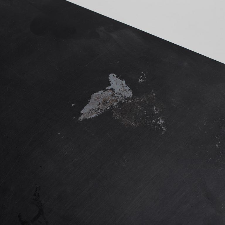 A modern square metal sofa table.