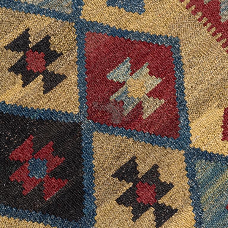 A Kelim rug, c. 250 x 142 cm.