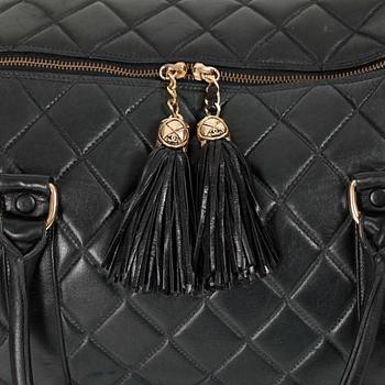 CHANEL, a black leather weekend bag.