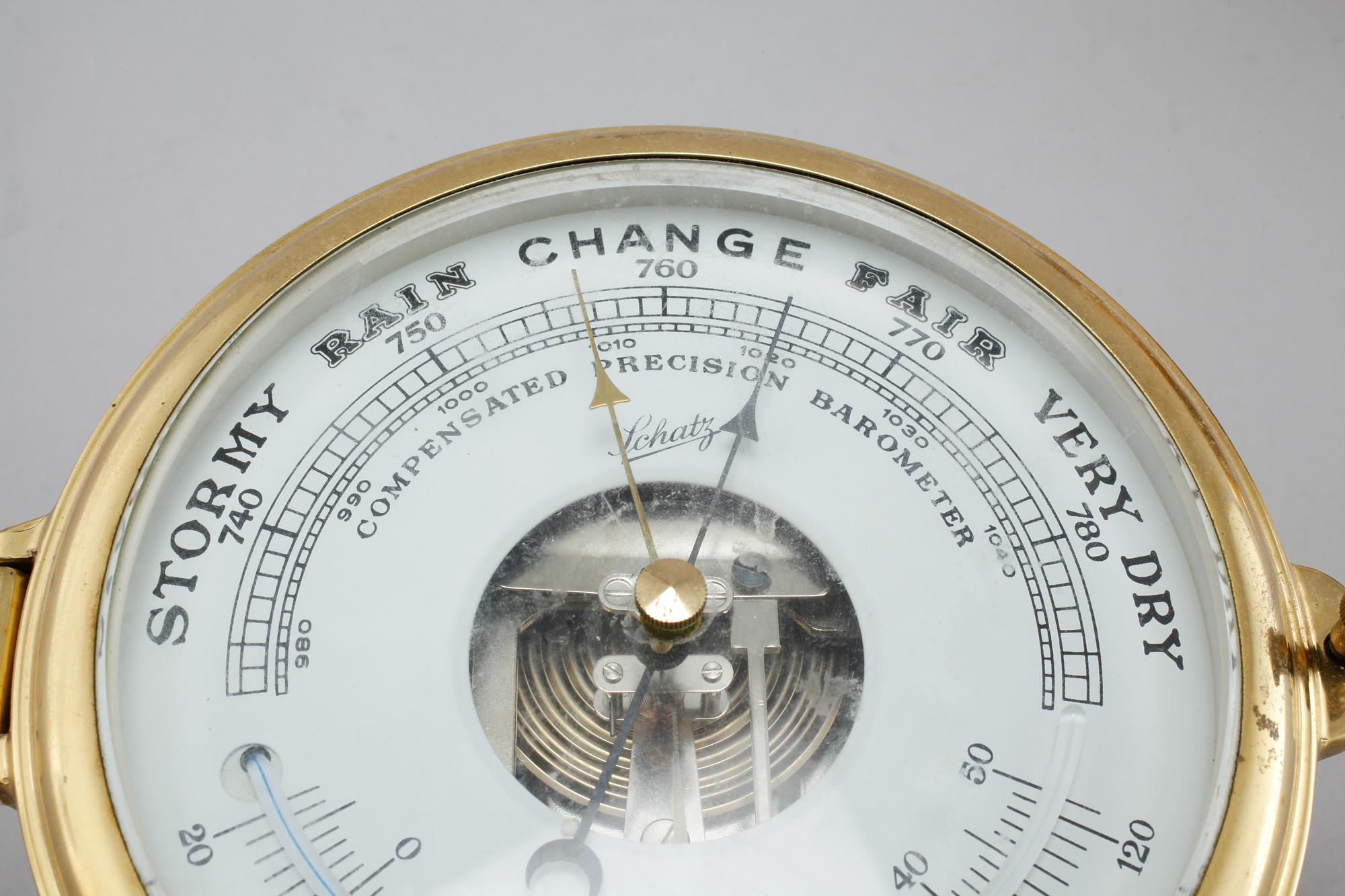 A wall clock and a barometer from Schatz, made in the fourth quarter of the 20th century.