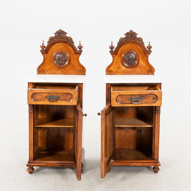 A pair of lacquered walnut and marble bedside tables from the first half of the 20th cenutry.