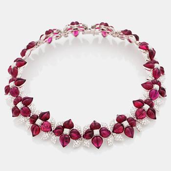 599. A carved pink tourmaline and diamond collar with floral motifs. Total carat weight of diamonds circa 16.00 cts.