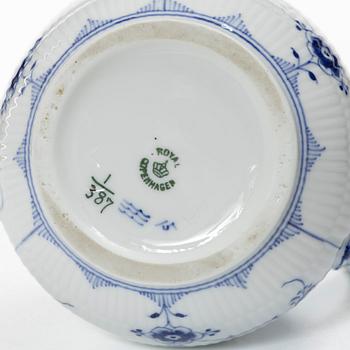 Royal Copenhagen, Three 'Musselmalet' jugs, circa 1900, and a Bing & Grøndahl cachepot, Denmark.