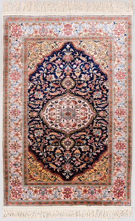 An Oriental silk carpet. Circa 150x103 cm.