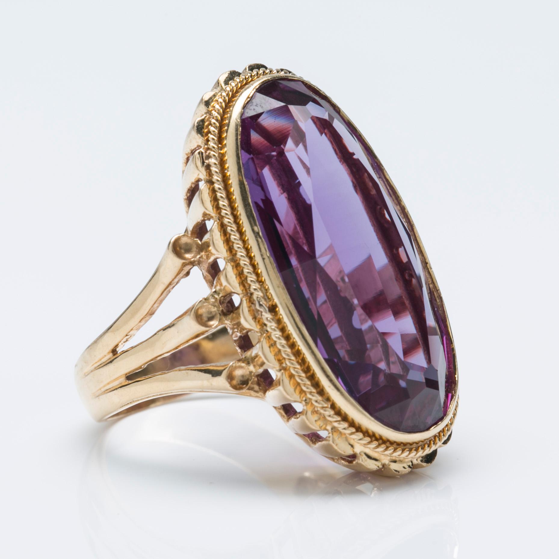 A synthetic alexandrite ring, 18K gold.