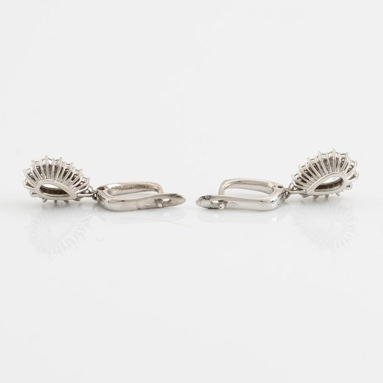 Pear shaped diamond earrings.