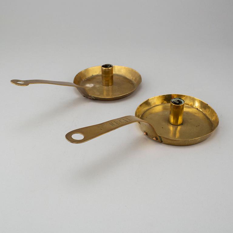 Two 18th century brass candlesticks.