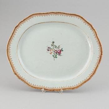 Two famille rose serving dishes and a sauce boat, Qing dynasty, Qianlong (1736-95).