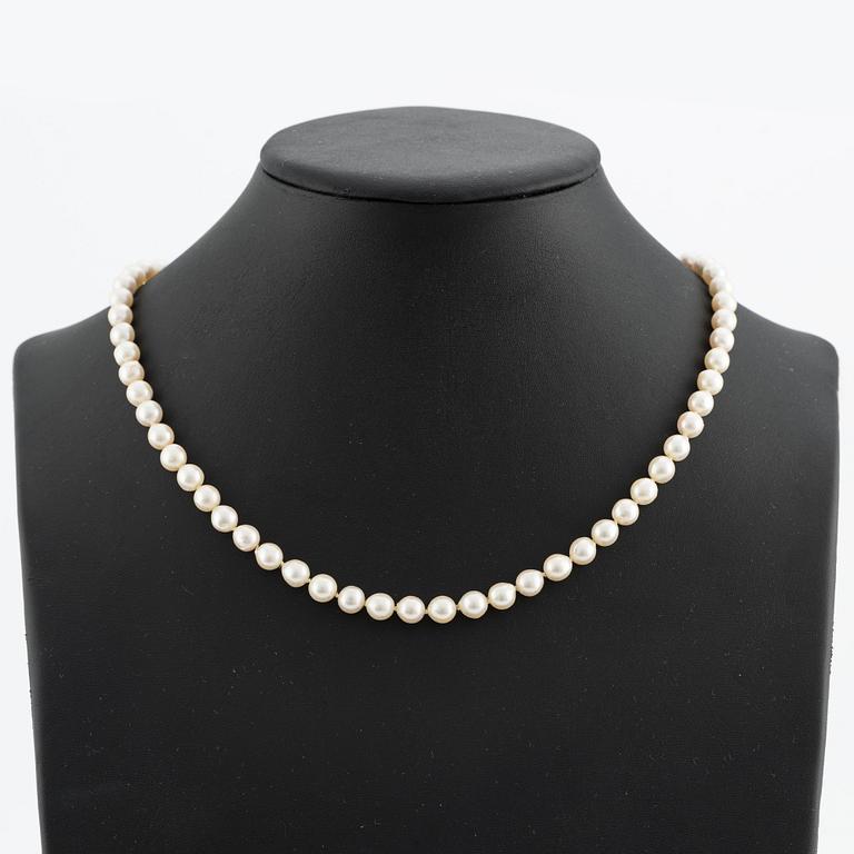 Necklace & bracelet, cultured pearls with 18K gold clasp and small diamonds.