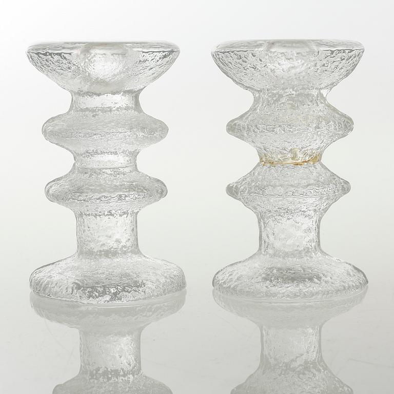 Five glass candlesticks by Timo Sarpaneva for Iittala, model "Festivo", second half of the 20th century.