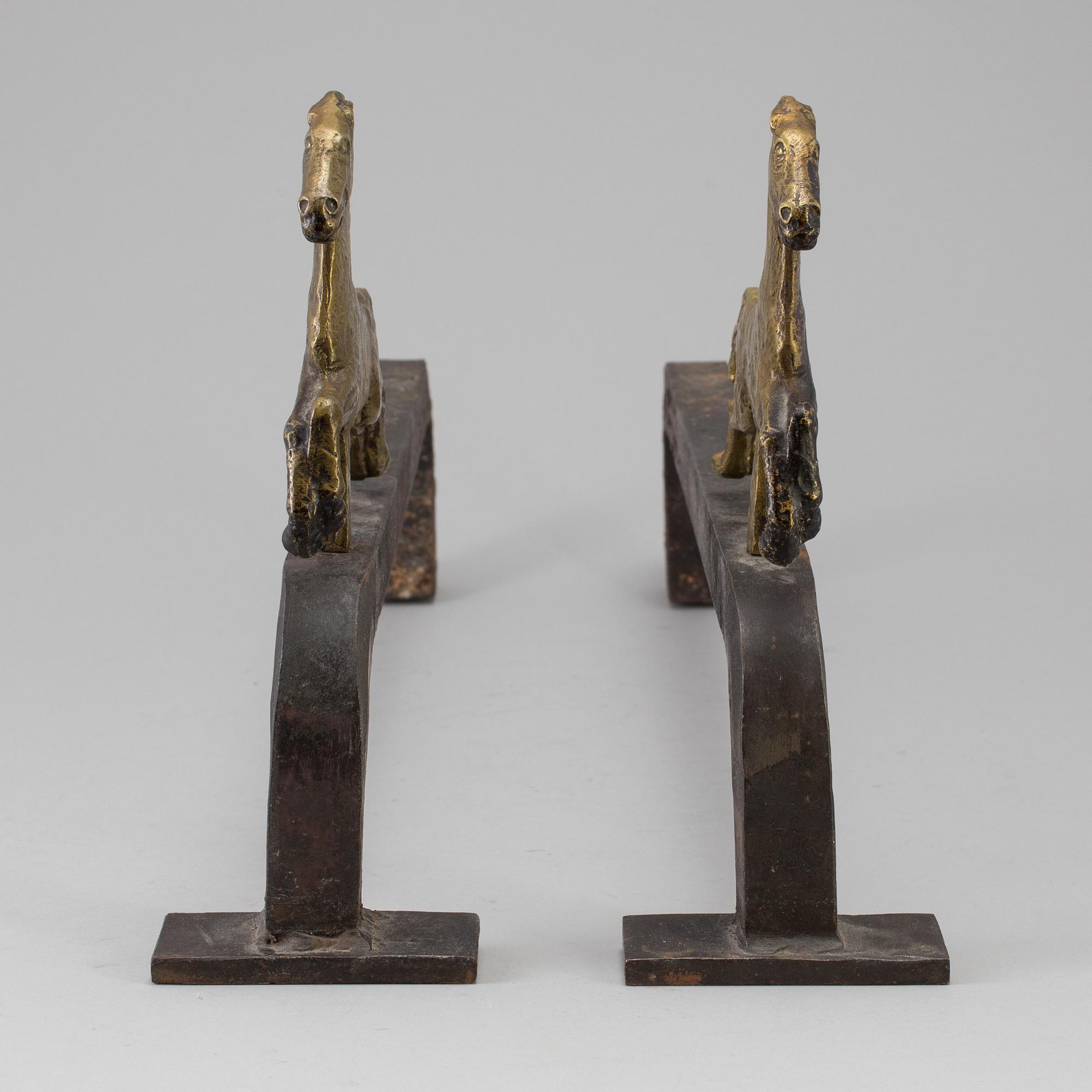 A PAIR OF IRON AND BRASS ANDIRONS by Tore Kullander, Borås 1943.