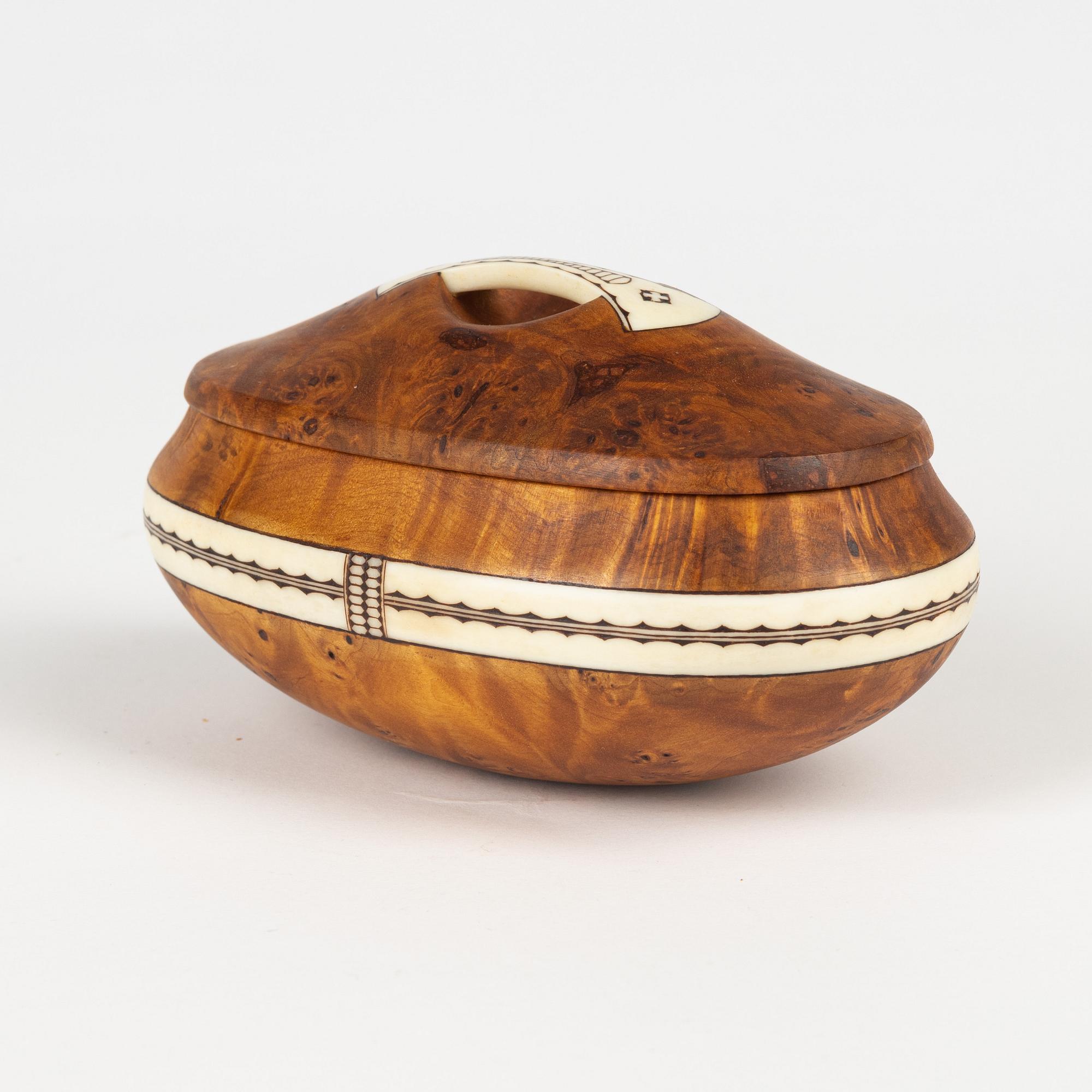 A birch box by Martin Kuorak, signed.