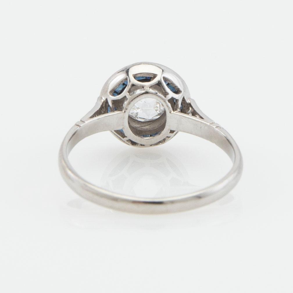 Halo ring, platinum with rose-cut diamond and sapphires.