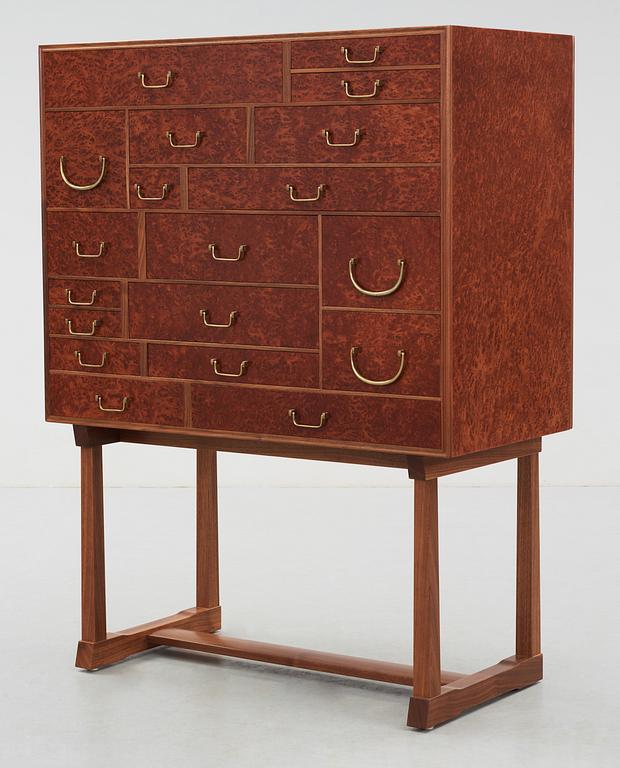 A Josef Frank cabinet on stand, model nr 881, by Svenskt Tenn.