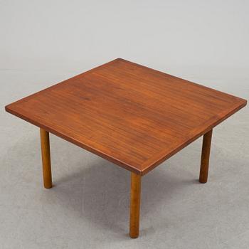 A 1960´s Danish Hans J. Wegner coffee table in oak and veneered with teak from Andreas Tuck.