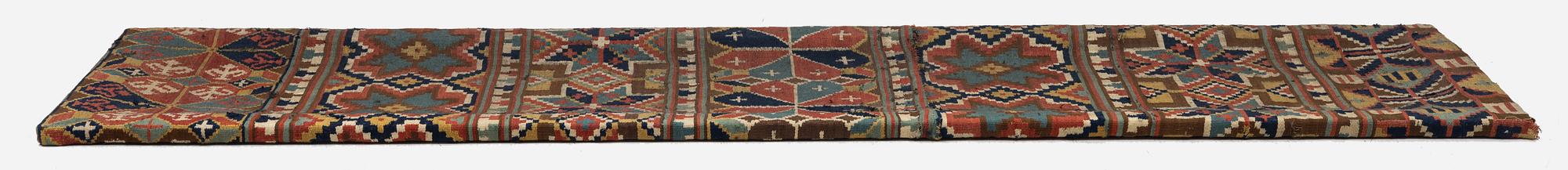 A flat weave 'Rosettes', Bench cushion c. 205 x 50 cm, Southwestern Scania, Sweden, first half of the 19th century.