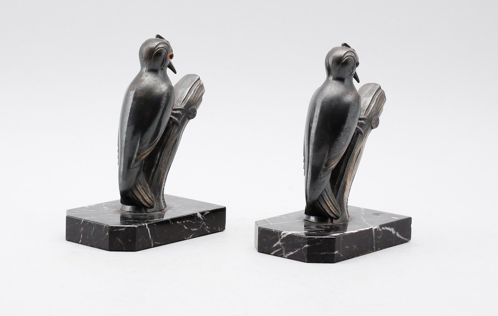 BOKSTÖD, 1 par, patinerad metall, signerade Franjuo, 1900-talets första hälft.