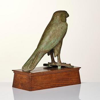 A fine and large Egyptian bronze figure of Horus the falcon, presumably late period Dynasty XXVI, (663-525 B.C.).