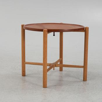 Hans J. Wegner, a model PP35 teak and oak tray table, Andreas Tuck, Denmark, mid 20th Century.