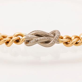 An 18K gold necklace weight 183,6 grams, 0,4 ct brilliants.