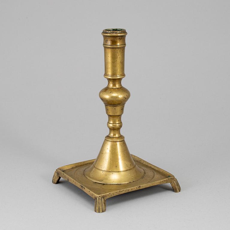 A 17th century bronze candlestick.