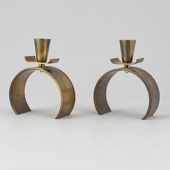 Carl-Einar Borgström, a pair of 'Svalan' candlesticks, Ystad metal, first half of the 20th Century.