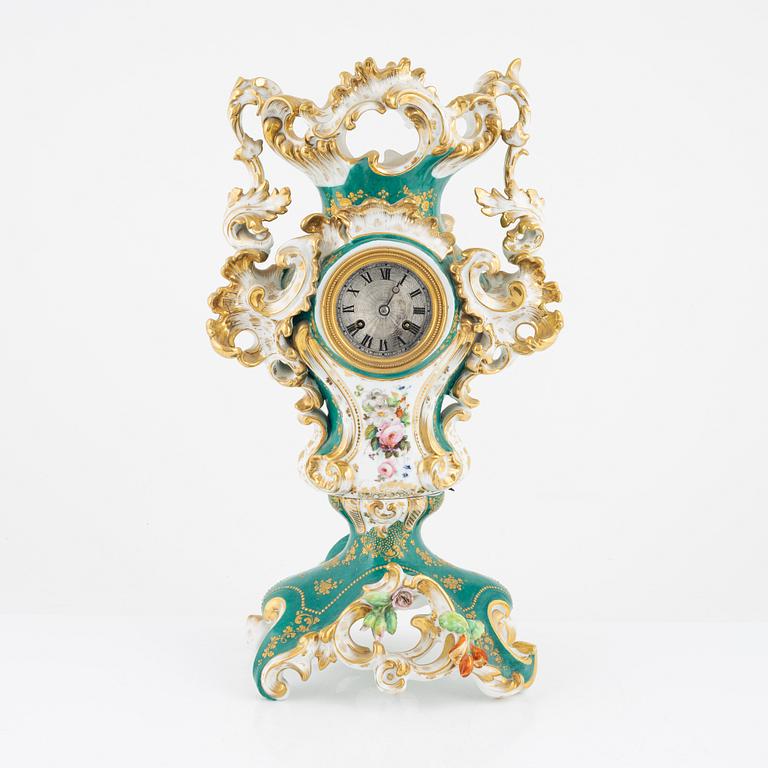 A porcelain mantle clock from around the year 1900.