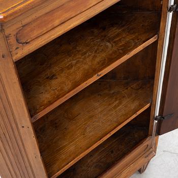 A Gustavian style pinewood corner cupboard, 19th Century.