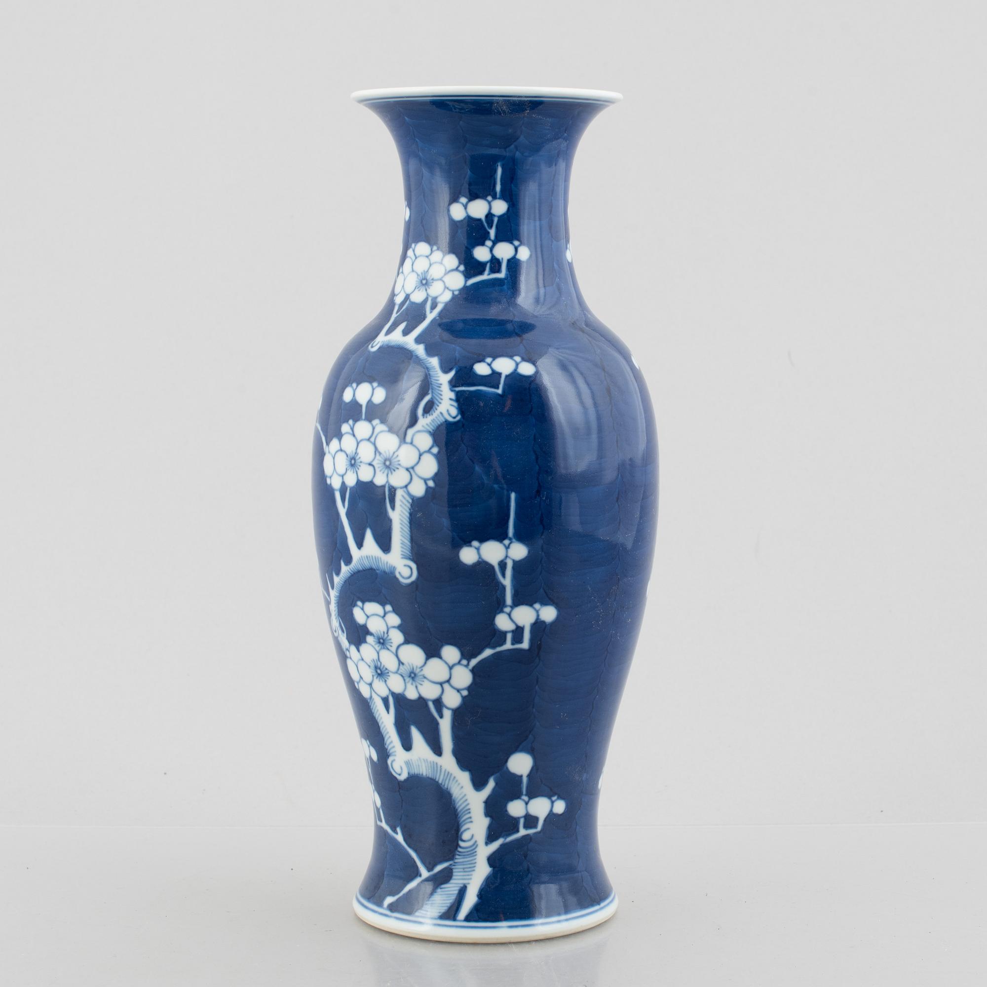 A Chinese porcelain dragon bowl, Qing dynasty, 19th century, and a blue and white porcelain vase, China, 20th century.