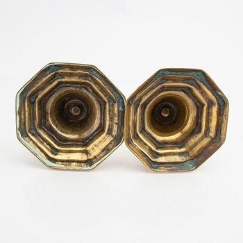 A pair of 18th century brass candle sticks.