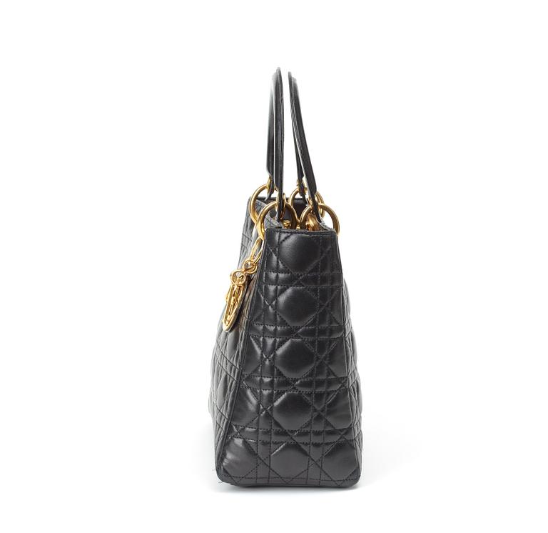 A black quilt leather handbag by Christian Dior.