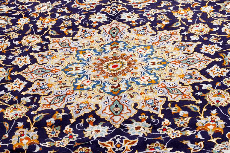 A Keshan rug, signed, 405 x 301 cm.